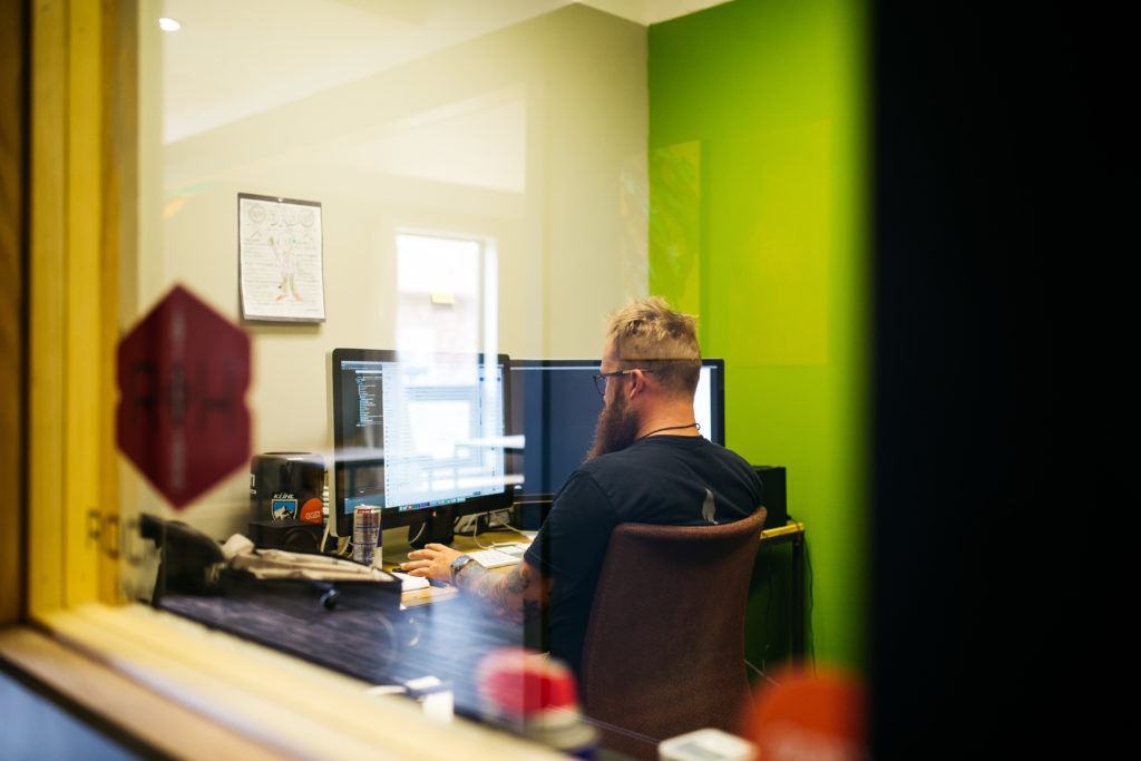 Man working in office at The Fellow Workspace